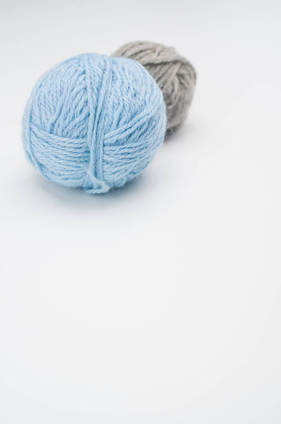 A vertical shot of isolated colorful yarns on a white background with text space - Photo, image