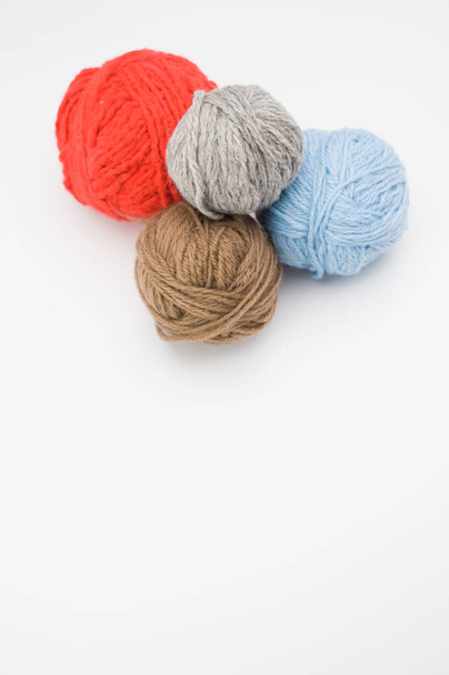 A vertical shot of isolated colorful yarns on a white background with text space - Foto, Bild