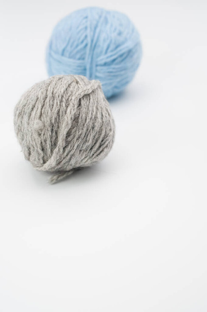 A vertical shot of isolated colorful yarns on a white background with text space - Photo, image