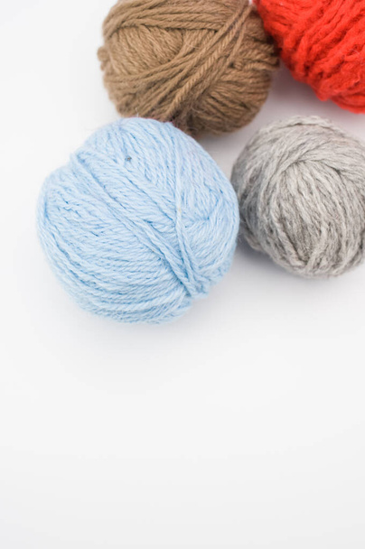 A vertical shot of isolated colorful yarns on a white background with text space - Foto, afbeelding
