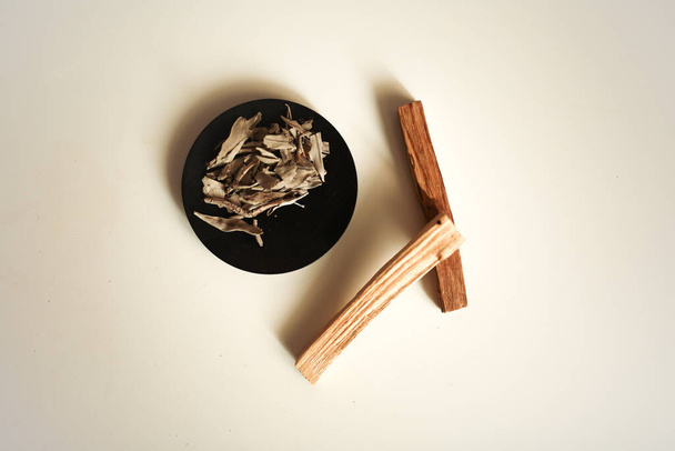 A top view image of several sticks of palo santo wood on a white background. - Foto, immagini