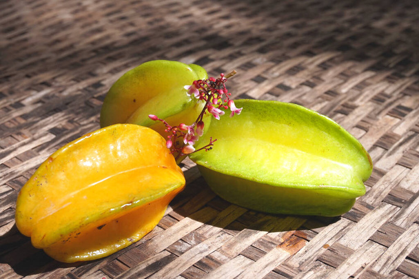 Carambola, also known as star fruit or 5 fingers, is the fruit of Averrhoa carambola, a species of tree native to tropical Southeast Asia - Photo, Image