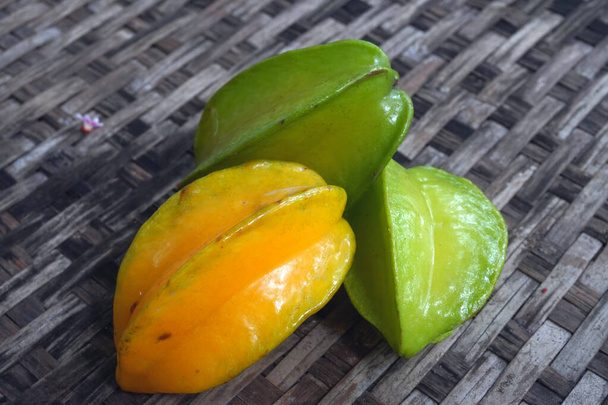 Carambola, also known as star fruit or 5 fingers, is the fruit of Averrhoa carambola, a species of tree native to tropical Southeast Asia - Photo, Image