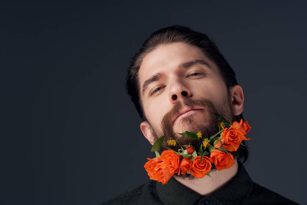 bearded man hairstyle fashion flowers emotions close-up - Фото, изображение
