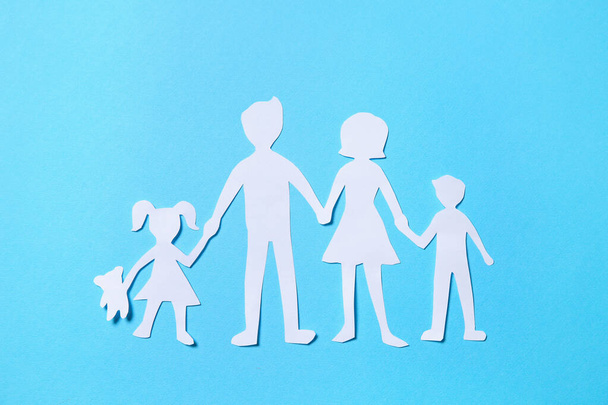 Paper family figures on light blue background, top view - Fotoğraf, Görsel