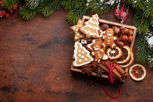 Christmas card with gingerbread cookies and spices. Top view flat lay with copy space - Fotoğraf, Görsel