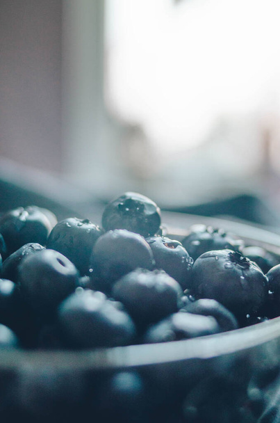 Vegan and vegetarian concept of fresh sweet berries. Big ripe blueberry closeup. Northern bilberry - Foto, Imagen