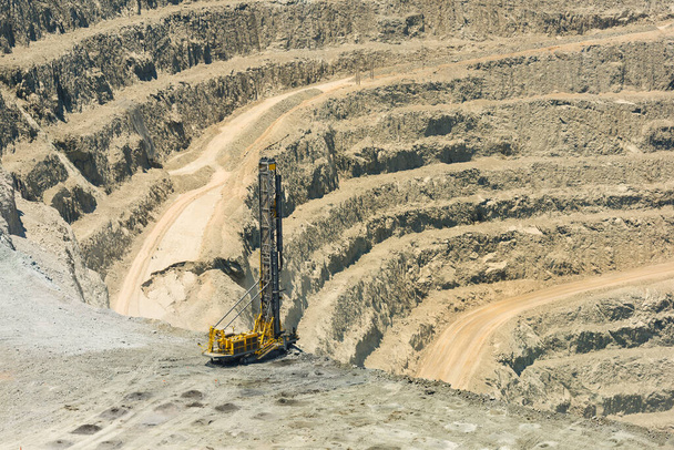 Blasthole drill in an open pit copper mine operation in Chile - Photo, Image