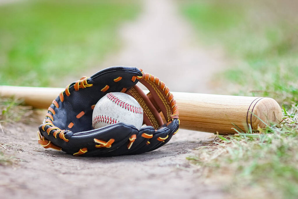 baseball bat concept with ball outdoors in the park on the field - Фото, зображення