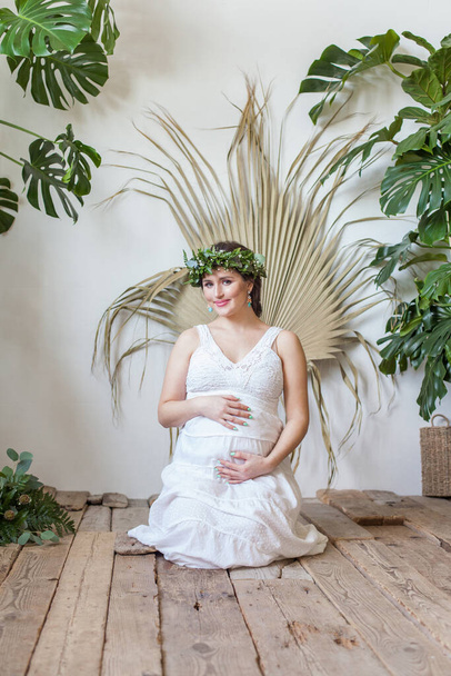 Happy pregnancy. Cute pregnant woman indoor - Fotó, kép