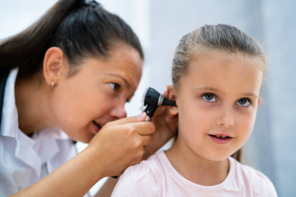 Otolaryngology Infection. Child Doctor Checking Ear Using Otoscope - Fotoğraf, Görsel