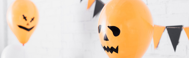 spooky orange balloons on halloween party, banner - Foto, Bild