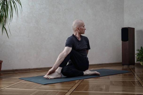 Yoga Practice Exercise Class Concept.  Man doing yoga - Photo, Image