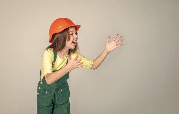 building and construction. child architect worker. engineer on grey background. - Foto, Bild