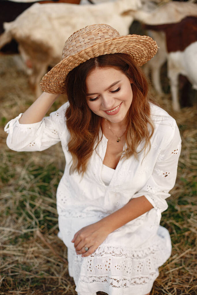 Putdoor portrait of young happy woman with goat - Φωτογραφία, εικόνα