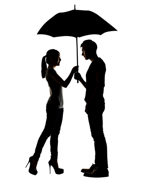 Silhouette of Asian couple holding umbrella - Photo, Image