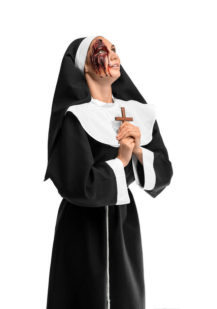 Woman dressed for Halloween as nun on white background - Fotoğraf, Görsel