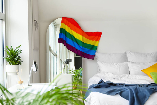 Interior of modern bedroom with flag of LGBT - Fotoğraf, Görsel