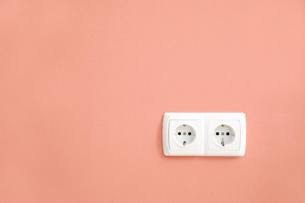 Electric socket on color wall - Photo, image