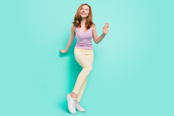 Full length body size photo girl in casual clothes happy smiling dancing at party isolated vivid teal color background - Foto, Bild