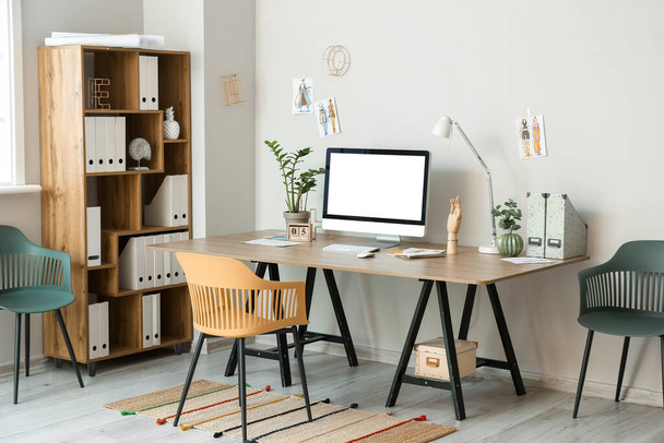 Interior of stylish room with modern workplace - Foto, imagen