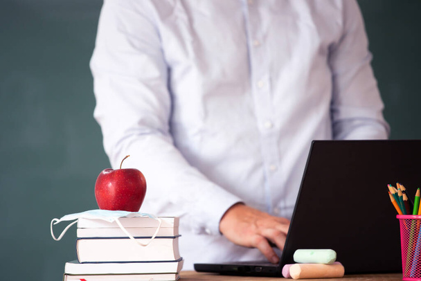 Back to School Concept. School math teacher giving virtual teaching remote class online lesson on laptop computer. - Фото, изображение