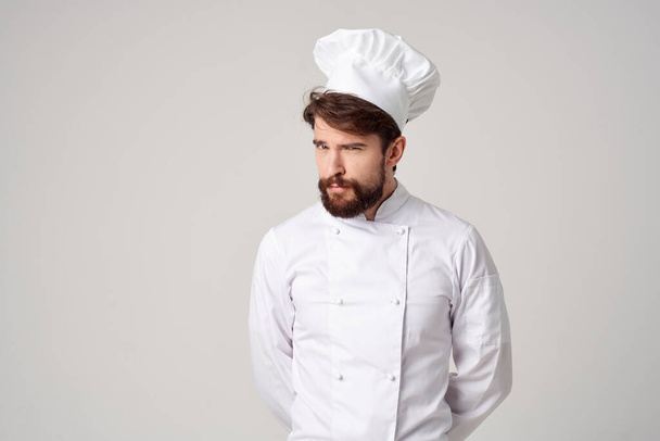 man kok werk uniform beroep keuken spul licht achtergrond - Foto, afbeelding