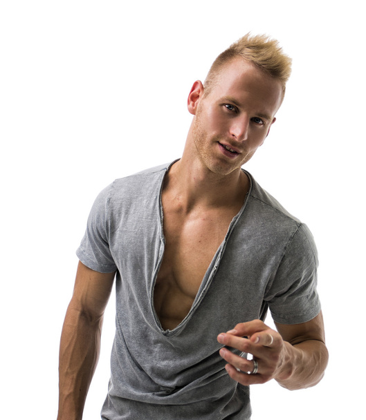 Fit male model smiling and pointing - Zdjęcie, obraz