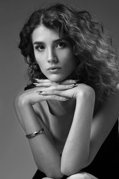 Studio black and white portrait of a beautiful sad brunette girl - Fotografie, Obrázek
