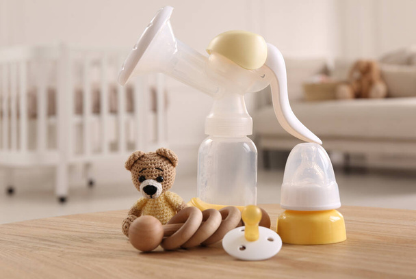 Baby care stuff on wooden table indoors. Maternity leave concept - 写真・画像