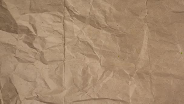Stop mozgás gyűrött kézműves papír háttér. - Felvétel, videó