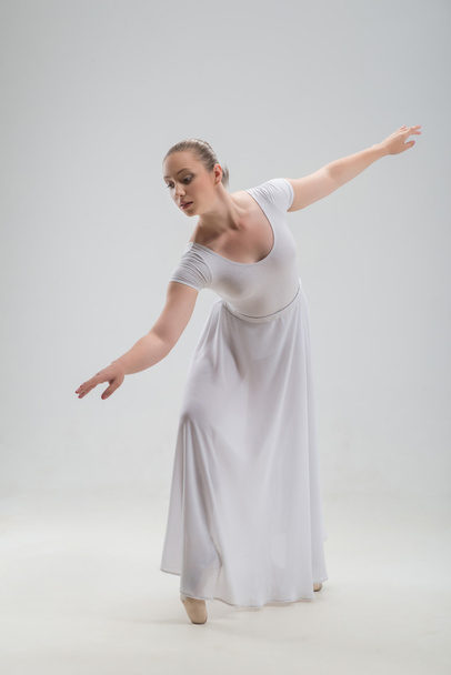 Young and beautiful ballet dancer posing isolated - Valokuva, kuva