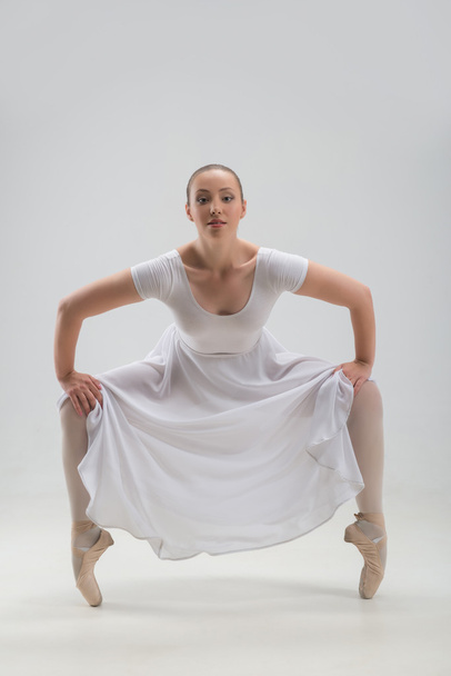 Young and beautiful ballet dancer posing isolated - Foto, Imagen