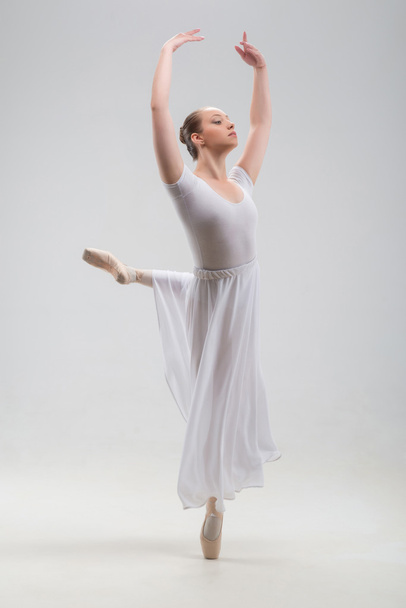 Young and beautiful ballet dancer posing isolated - Fotó, kép