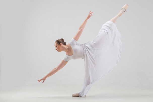 Young and beautiful ballet dancer posing isolated - Foto, imagen