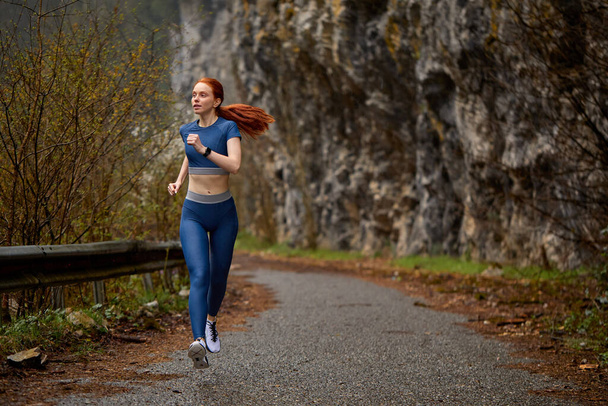 Running outdoors. Active Runner woman jogging in spring forest. fitness sport model jogging - Fotografie, Obrázek