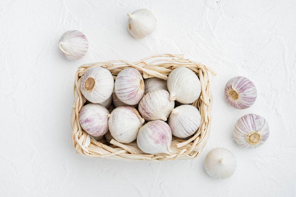 Baby garlic set, on white stone table background, top view flat lay - Fotoğraf, Görsel