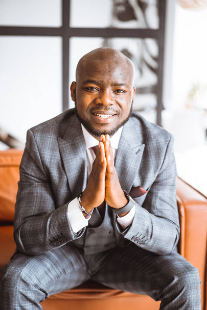 Happy Laughing Rich African American Businessman. Successful Tycoon Folded Hands Gesture In Stylish Expensive Suit. Concept Of Rich Life, Successful - Fotó, kép