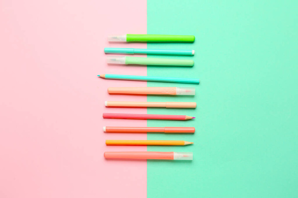 Colorful markers and pencils on color background - Photo, Image