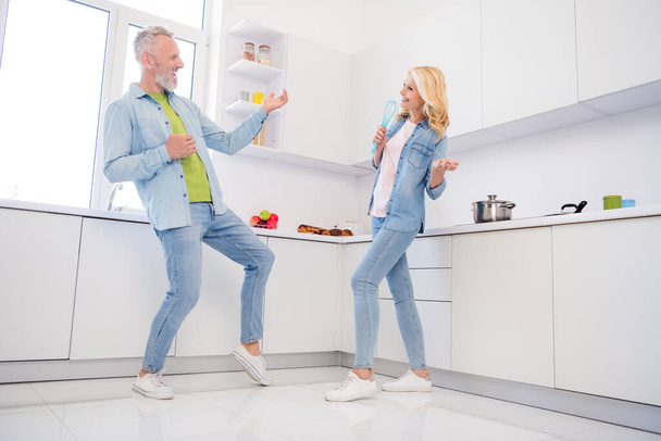Photo of cute adorable mature lovers dressed jeans shirt dancing smiling indoors room home - Fotoğraf, Görsel