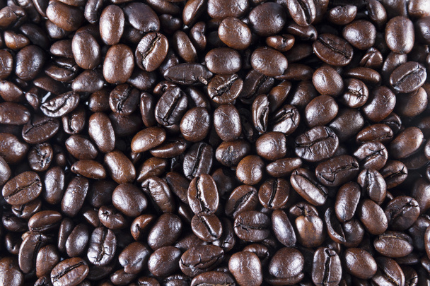 コーヒー豆。背景やテクスチャに散在。マクロ. - 写真・画像