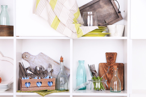 Kitchen utensils and tableware on beautiful white shelves - Φωτογραφία, εικόνα