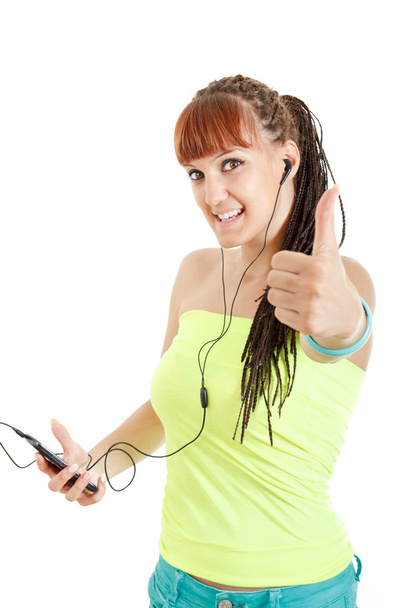 Красива жінка з навушниками слухає музику і показує великий палець u
 - Фото, зображення