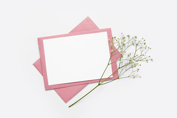 Blank card and flowers on white background - Foto, imagen