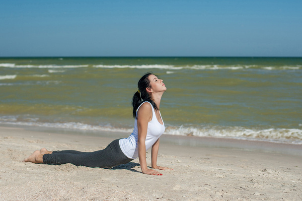 young woman practicing yoga - Фото, зображення