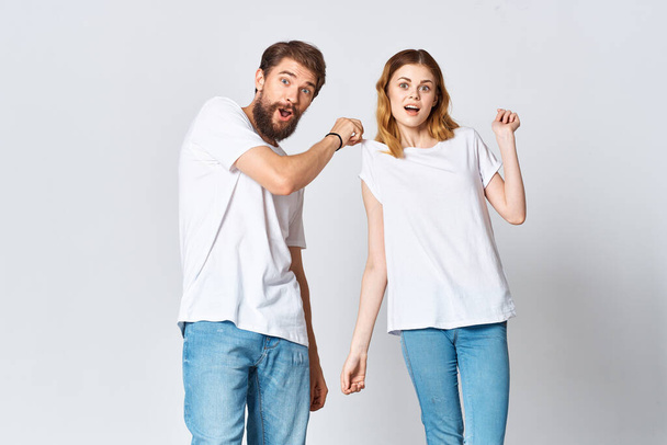 man and woman in white t-shirts studio fashion posing - Photo, Image