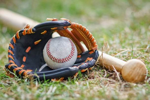 baseball bat concept with ball outdoors in the park on the field - Photo, Image