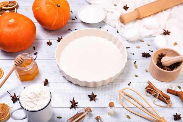 Ingredients for pumpkin pie with cinnamon and pecan nuts - Photo, Image