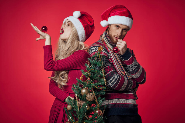 man and woman christmas holiday new year romance red background - Photo, Image