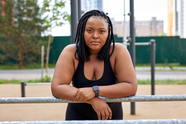 Portrait Of Fat Afro American Woman Confidently Looking At Camera After Sport Workout - Фото, изображение